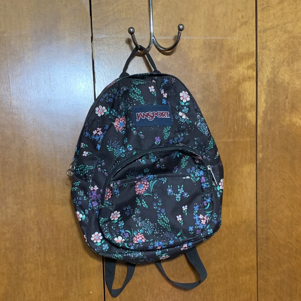 Jansport Black Mini Backpack with Pink, Purple & Green Floral Print.